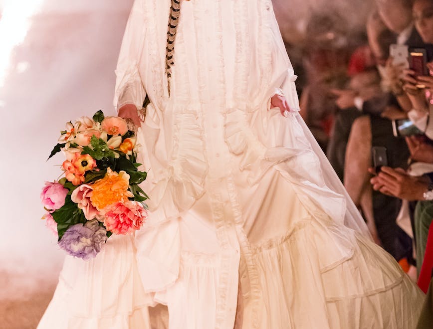 clothing person plant female robe fashion gown flower flower bouquet flower arrangement