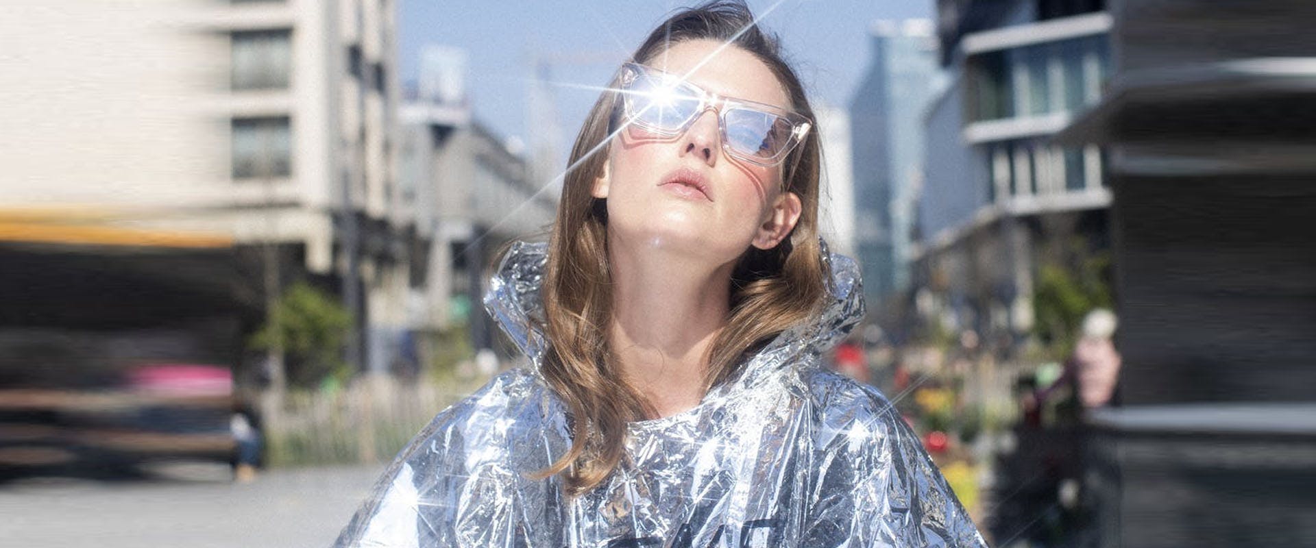clothing apparel coat person human raincoat sunglasses accessories accessory
