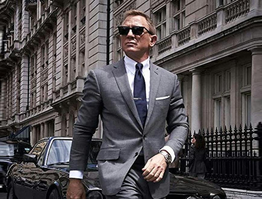 clothing suit overcoat coat tie accessories sunglasses person man car