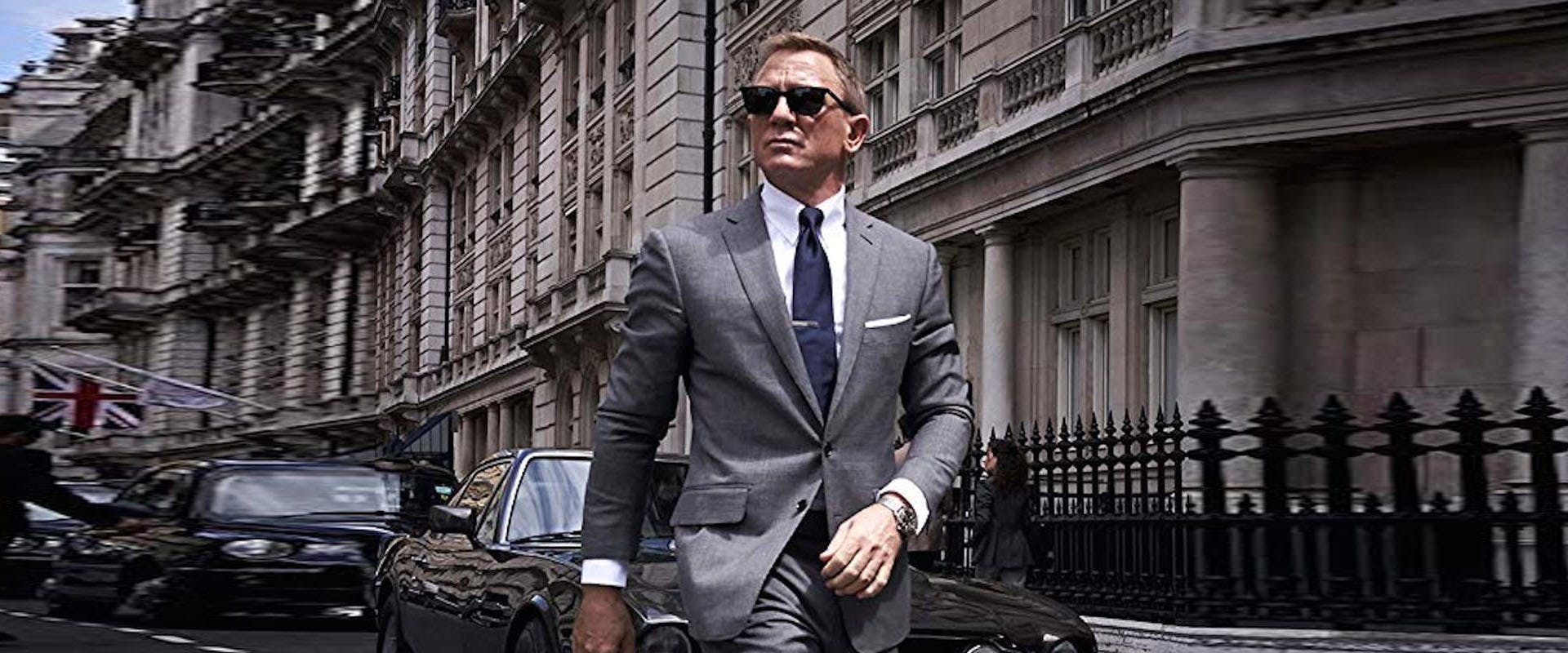 clothing suit overcoat coat tie accessories sunglasses person man car
