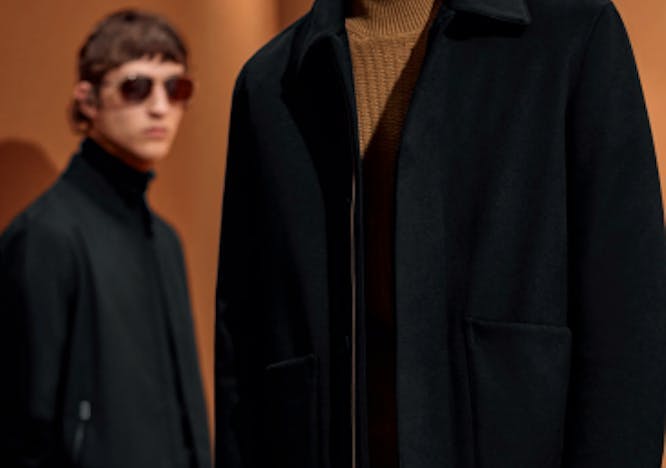 clothing apparel coat overcoat jacket person human sunglasses accessories suit
