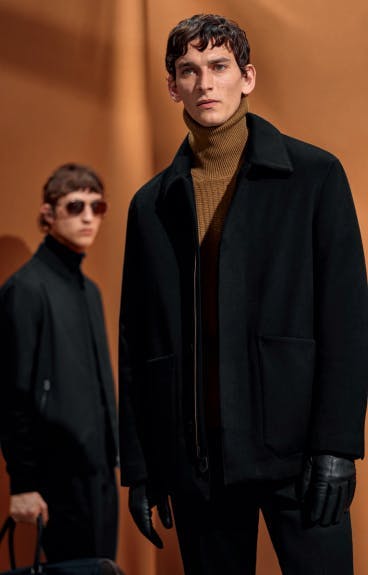 clothing apparel coat overcoat jacket person human sunglasses accessories suit