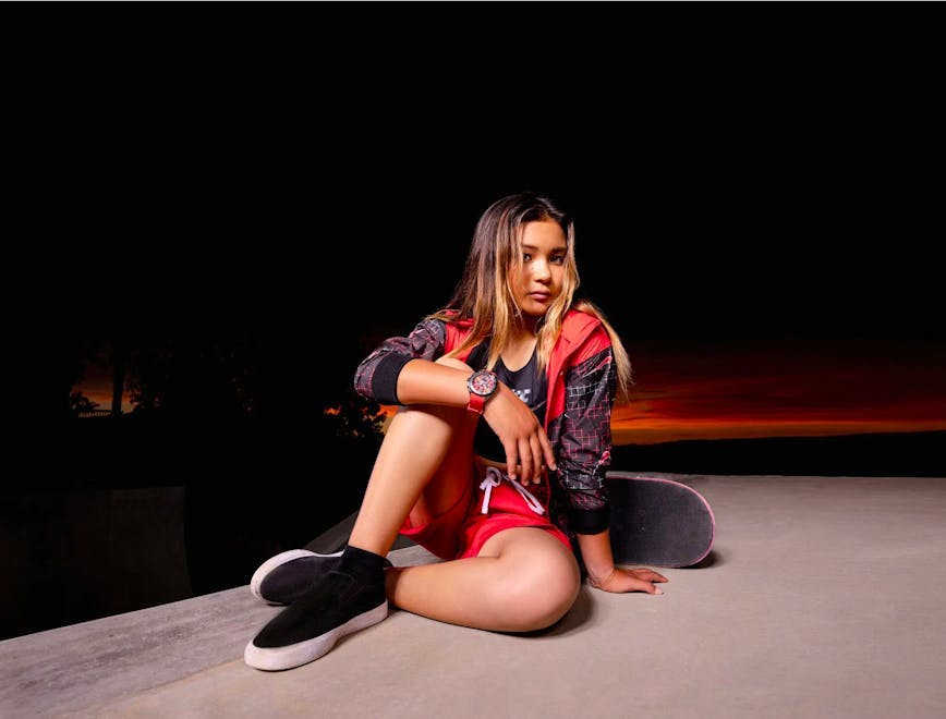 sitting person teen girl female solo performance performer fashion skateboard