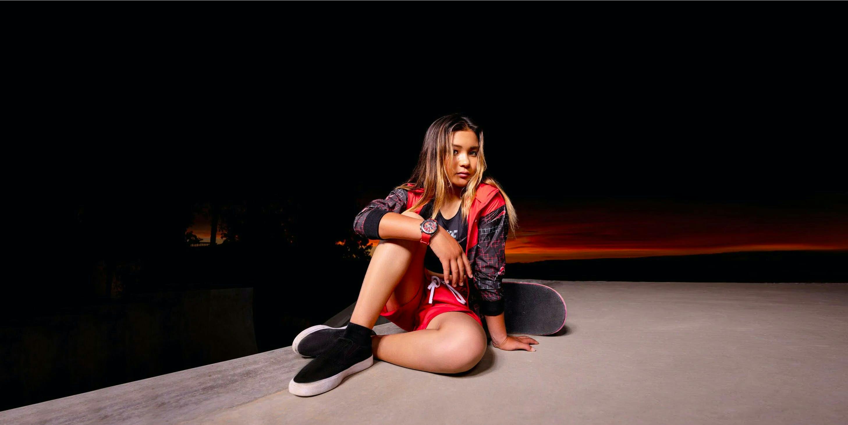 sitting person teen girl female solo performance performer fashion skateboard