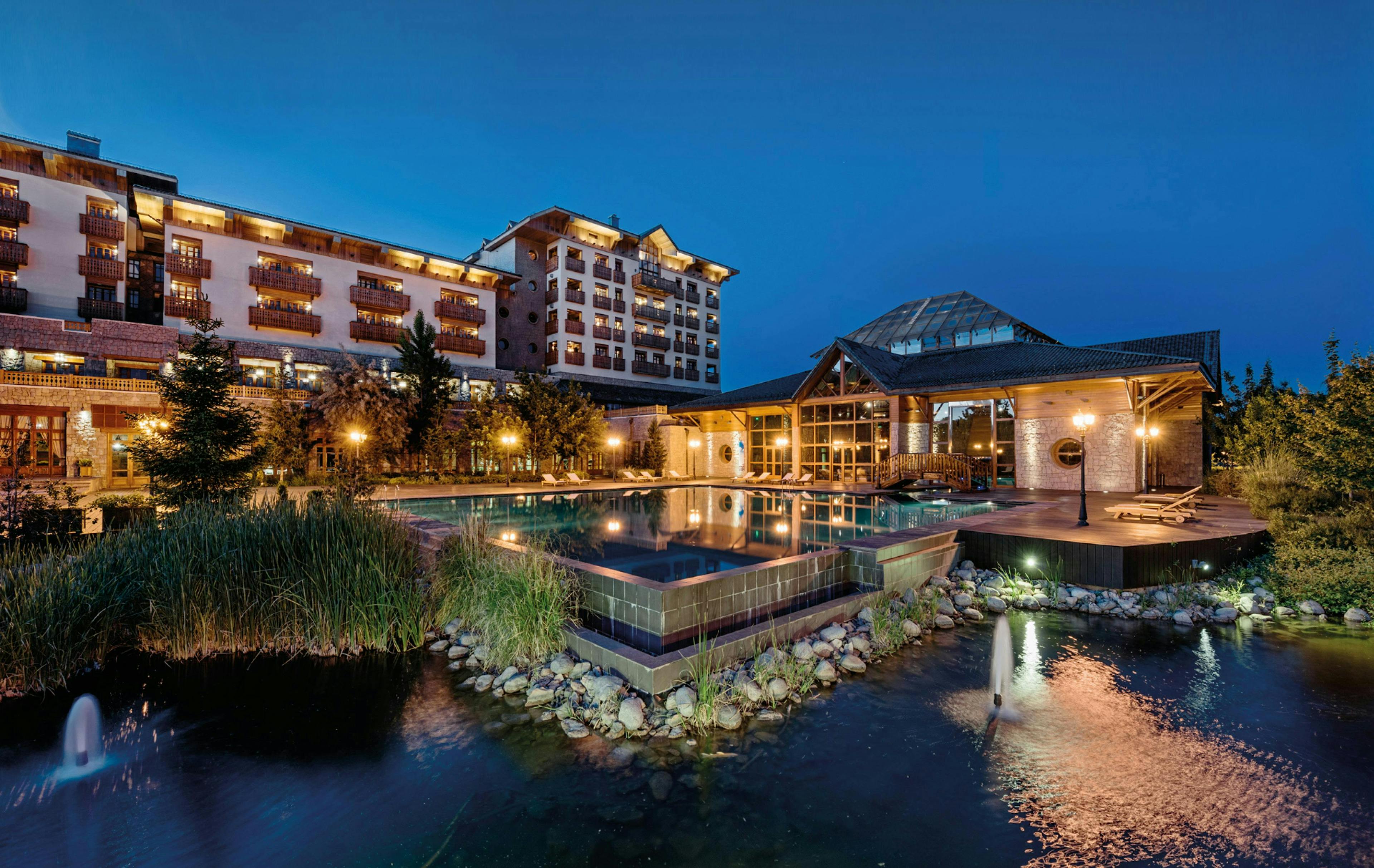 building hotel resort outdoors scenery water waterfront pool fir swimming pool