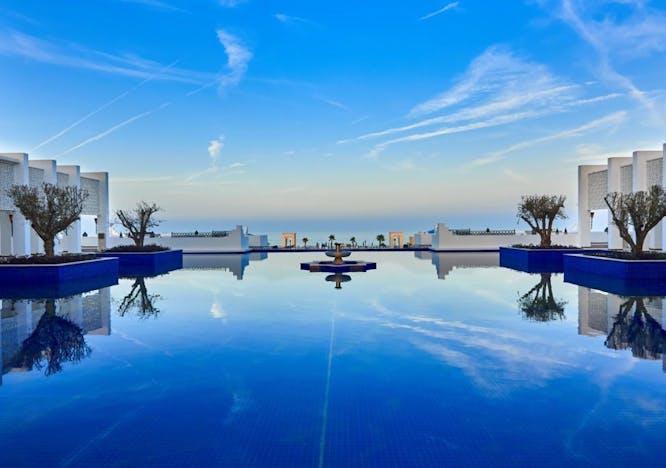 pool water swimming pool building hotel resort city outdoors sky scenery