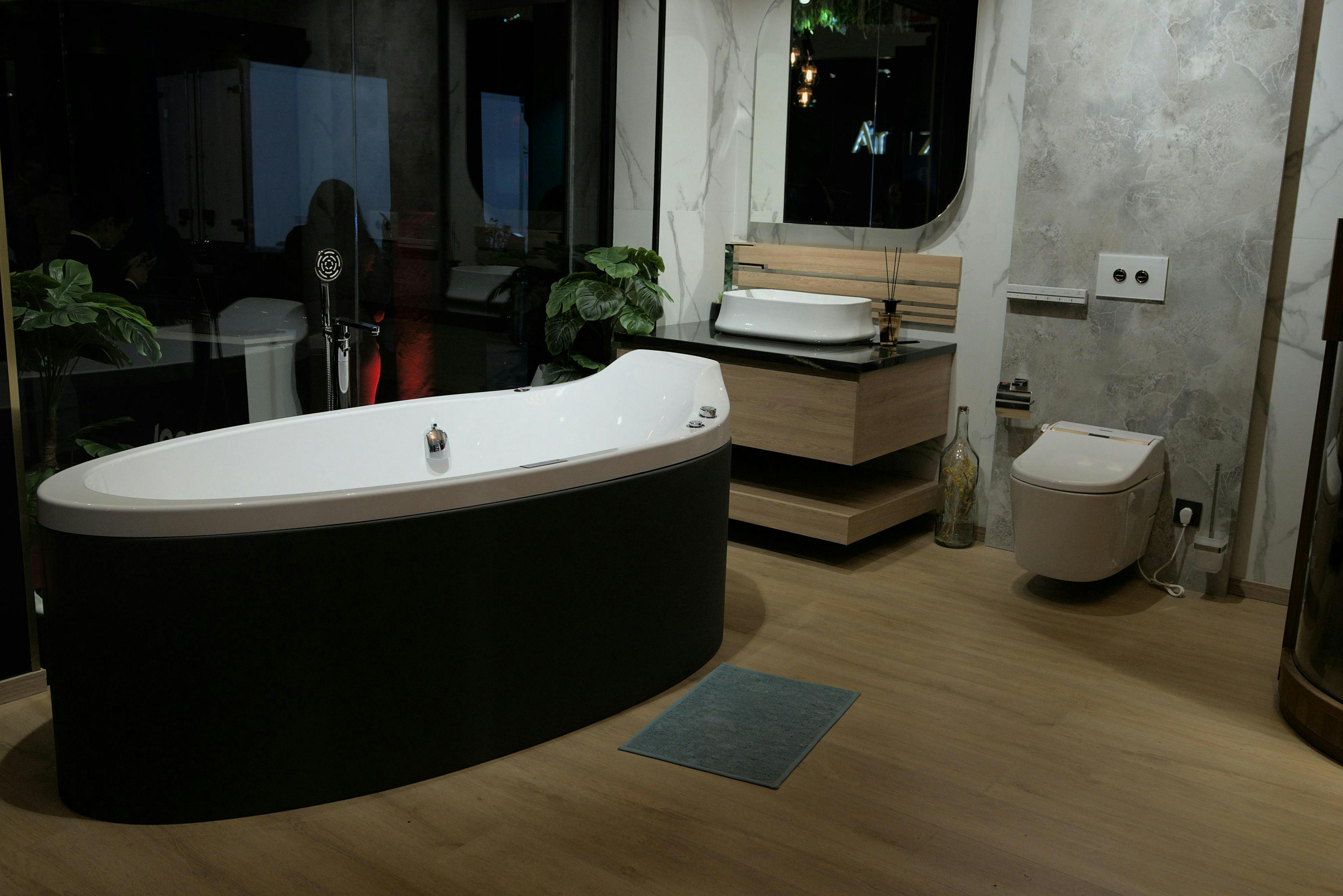 floor flooring tub bathing bathtub person interior design wood hardwood hot tub